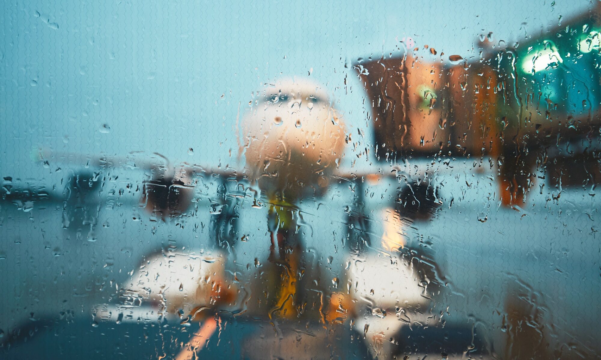 A busy airport in the rain
