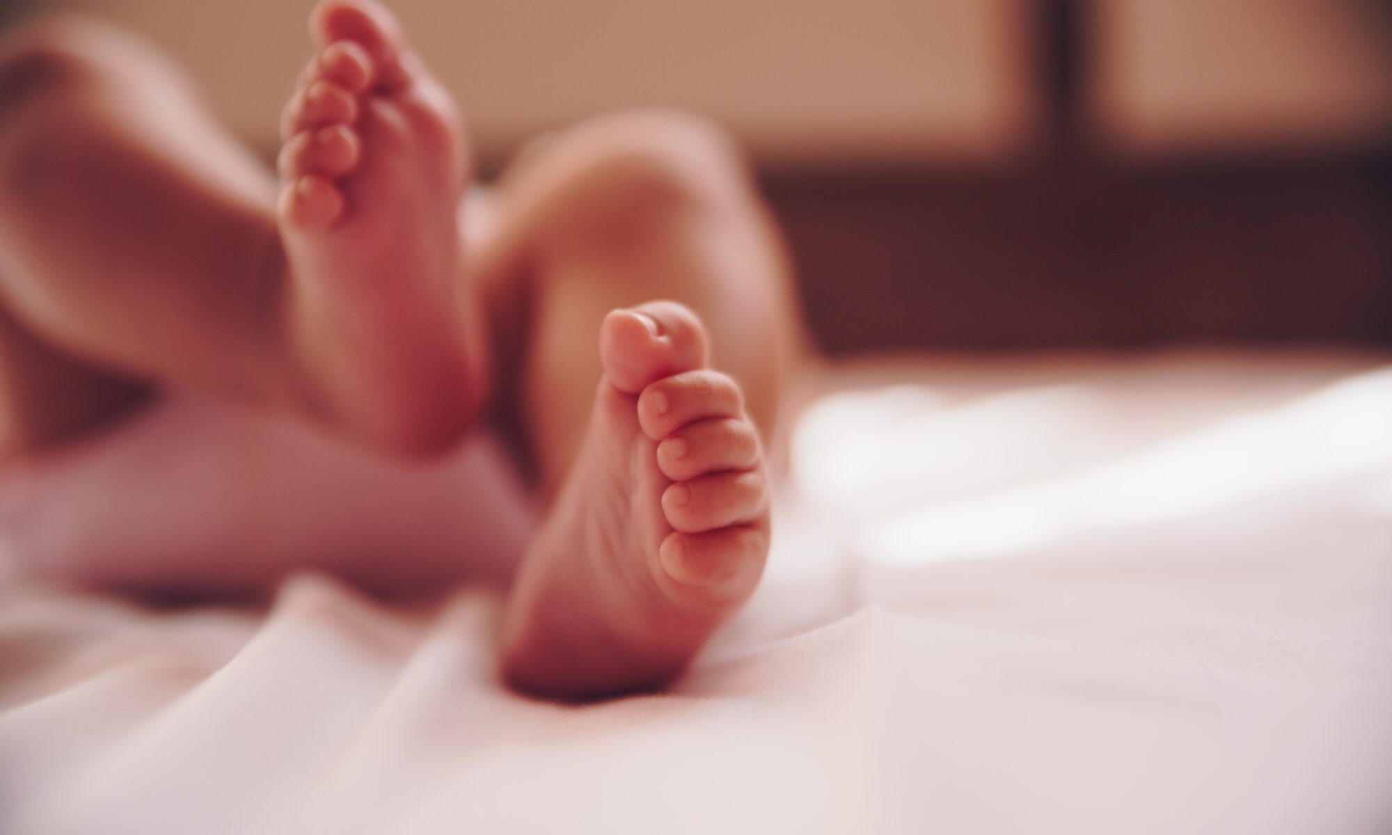Close up of infant baby feet.